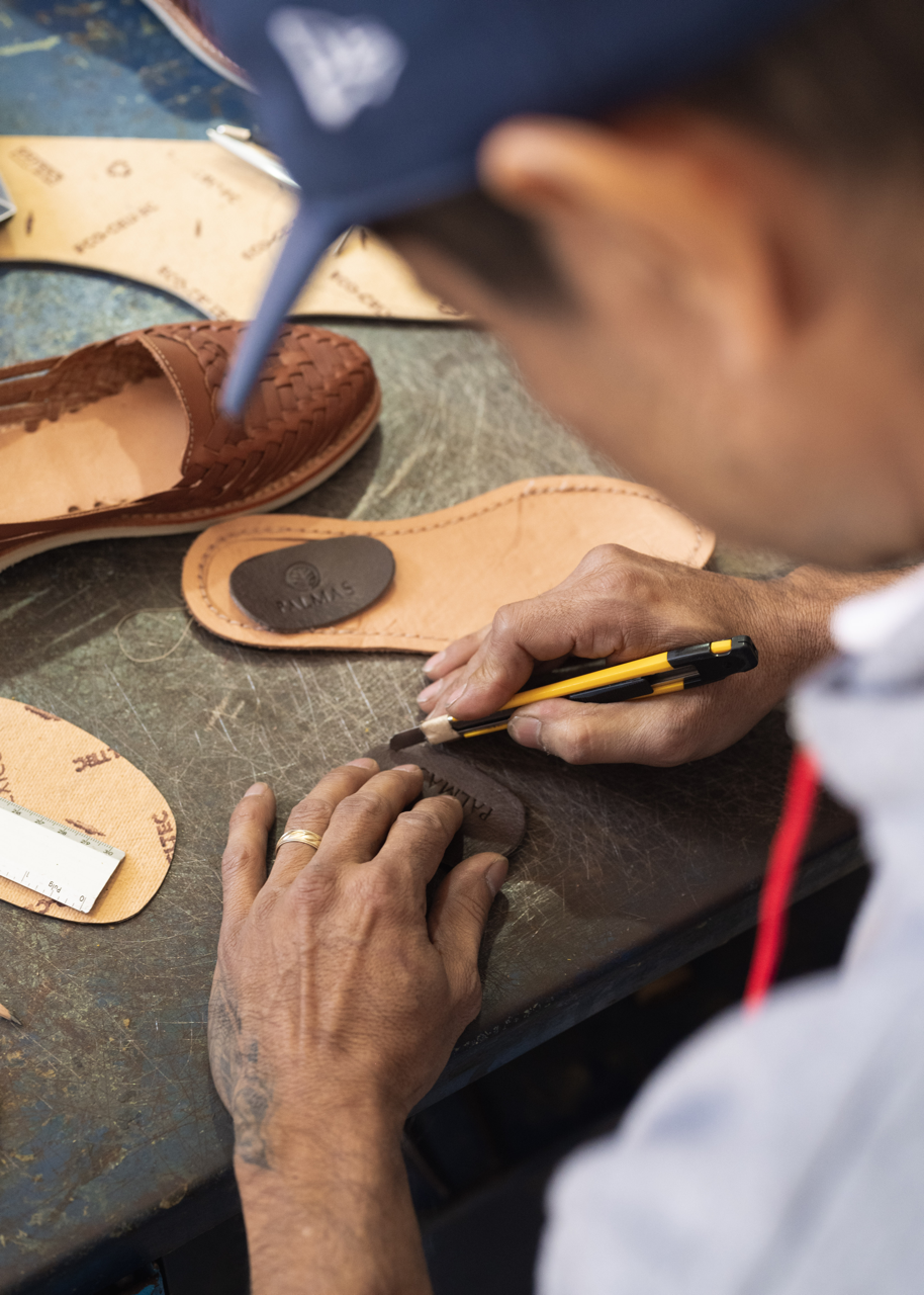 Huarache maker, handcrafting palmas leather huaraches.